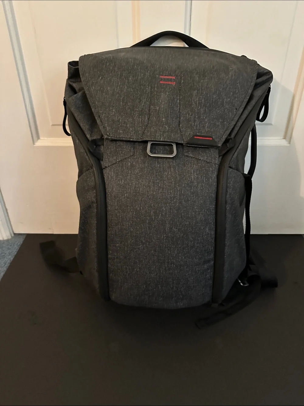 Peak Design Dark Gray Everyday Backpack with Red Accent.